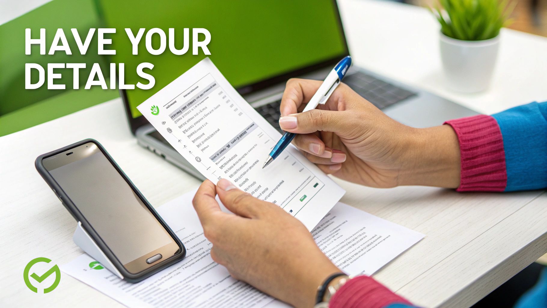 Person reviewing important details on a document with a pen, phone, and laptop.